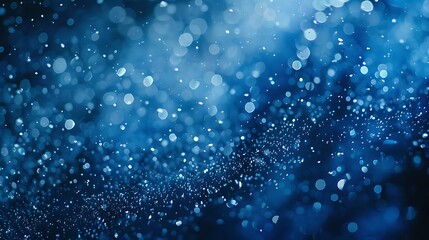 Blue Christmas snowfall background with delicate flakes gently falling, creating a serene and magical winter atmosphere perfect for holiday celebrations and festive cheer.