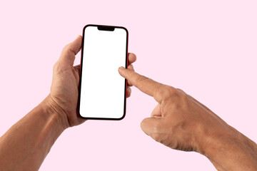 Male hands holding a red smartphone with blanc screen, pointing gesture, on pink background mockup
