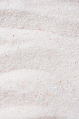 Natural Himalayan Pink Salt Fine Ground Top View Abstract Texture Vertical Background