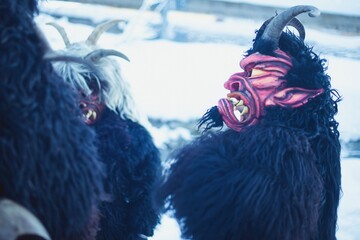 Krampus figures in the winter snow, Tyrol, Austria