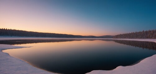 Fototapeta premium Frozen lake at sunrise with snowy forest reflection