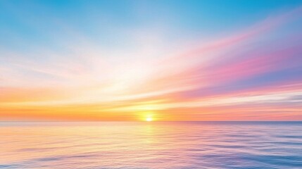 Obraz premium A stunning sunrise over the calm sea, showcasing vibrant hues of orange, pink, and blue in the sky, reflecting beautifully on the water's surface.