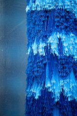 Blue brush washer at an automatic carwash station