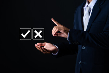Businessman showing check right and wrong choice The idea is to decide to vote. Think yes or no...
