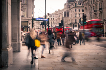 Busy shopping street scene with motion blur