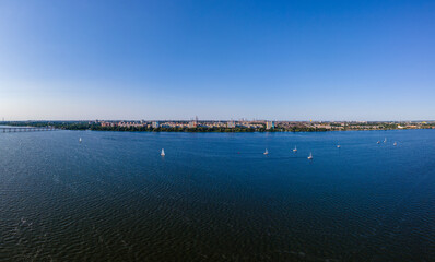 Obraz premium Dnepr, Ukraine. View of the left bank from the Dnieper River. Top view from a great height. Panoramic view of the city. Panoramic view of the city. Summer day. place to travel