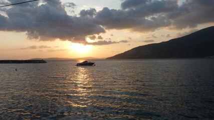 Solitary Boat at Sunset: A Quiet Witness to the Day’s Farewell, Reflecting Serenity, Solitude, and the Endless Horizon of Life’s Journey in the Golden Glow of Nature’s Beauty