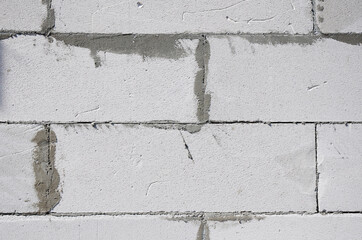 Autoclaved Aerated Concrete (AAC) blocks textured background wall. Aerated autoclaved concrete blocks installation concept