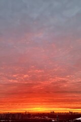 Red and grey sunrise in the city