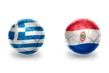 Obraz premium football balls with national flags of greece and paraguay ,soccer teams. on the white background.