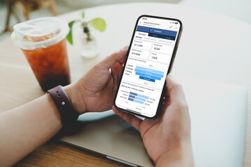 Person wearing smartwatch reviewing Contoso sales dashboard on smartphone, displaying revenue goals, pipeline stages and product performance metrics.