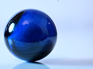 Closeup on colorful marbles on white background