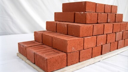 Obraz premium A clean arrangement of classic red bricks, perfect for construction and architectural visuals