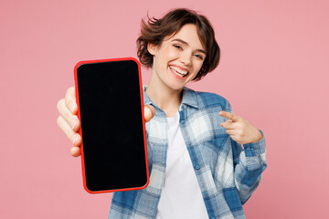 Young woman wear blue shirt white t-shirt casual clothes hold in hand use point finger on mobile...