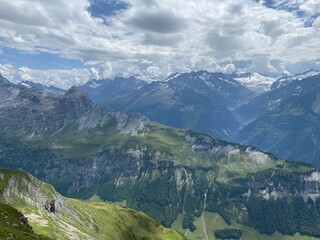 Fototapeta premium View of the Urner Alpen from the peaks above Lake Melchsee or Melch Lake in the Uri Alps mountain massif, Kerns - Canton of Obwald, Switzerland (Kanton Obwalden, Schweiz)
