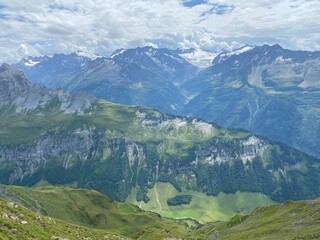 Fototapeta premium View of the Urner Alpen from the peaks above Lake Melchsee or Melch Lake in the Uri Alps mountain massif, Kerns - Canton of Obwald, Switzerland (Kanton Obwalden, Schweiz)