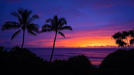 Obraz premium Vibrant Sunset Over Ocean Silhouetted By Palm Trees