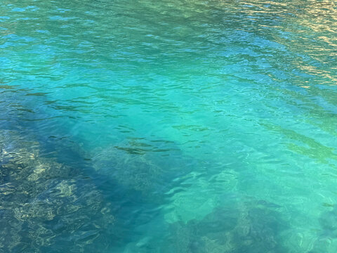 Sea green emerald clear water surface.