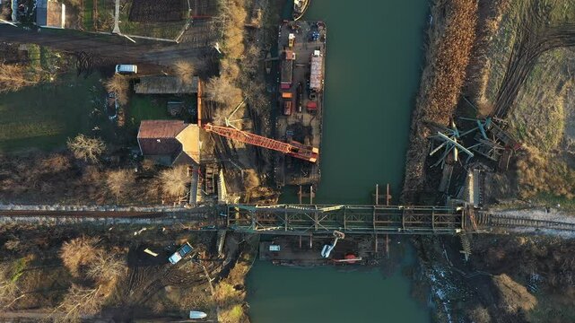 Aerial view on worker as they cutting waste metal of bridge by mixing oxygen and acetylene gas, propane