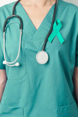 Doctor holding Teal Ribbon for January Cervical Cancer Awareness month. Uterus and Ovaries, Cervix, Endometriosis, Hysterectomy, Uterine fibroids, Reproductive, Healthcare and World cancer day