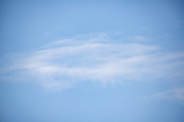 A blue sky with a few clouds