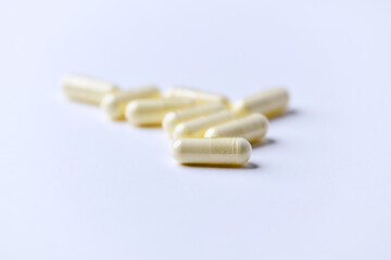 Alpha-lipoic acid capsules. Paper background. Soft focus. Close up. Copy space.