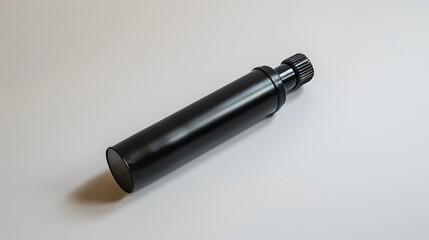 Fototapeta premium A police-issue pepper spray canister lying flat on a white background.