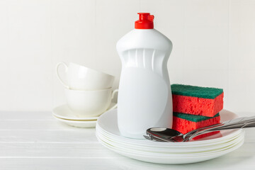 Colorful dish sponges on textured background. Kitchen sponge. Cleaning concept, cleaning service. Dishwashing liquid with clean and dirty dishes plate. Place for text, copy space. Wash the dishes.