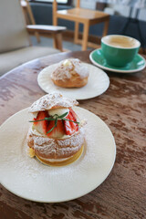 choux cream or cream puff, eclair or strawberry choux cream  and coffee
