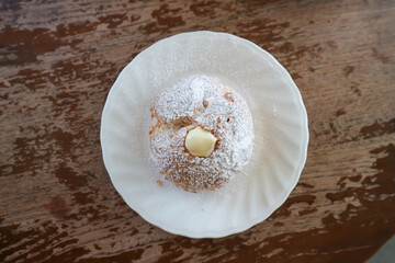 choux cream or cream puff, eclair in a small dish