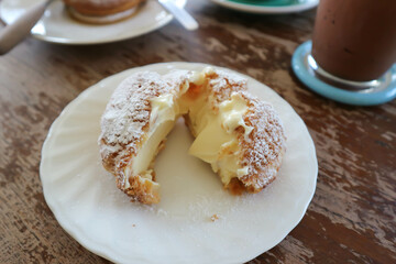 choux cream or cream puff, eclair in a small dish