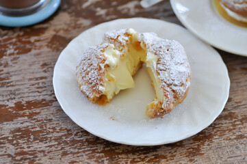 choux cream or cream puff, eclair in a small dish
