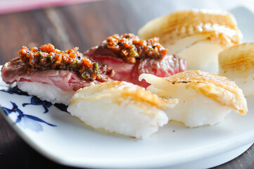 engawa sushi and gyuuniku sushi , rice topped with fish or Japanese food
