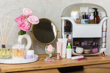 Storage of cosmetics on dressing tabl.Cosmetic box on the dresser. Set of body care cosmetic products. Decorative and care product. Cosmetic bag. Storage box. Beauty concept. Makeup. Space for text.