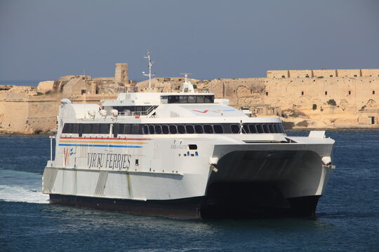 Jean de la Valette, a high speed passenger / car ferry of Virtu Ferries, leaving the Port of Valetta, Malta, Europe