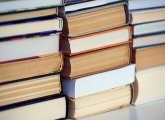A simple composition of many hardback books. Going back to school. Education.