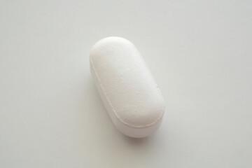 White medicine pill tablet on white background