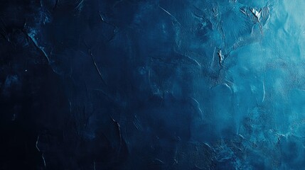 Obraz premium Textured dark blue concrete wall in a studio, perfect as a backdrop for product showcases, featuring rich tones and a subtle sheen.