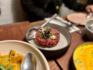 Beef steak tartare with soybean sprouds served at restaurant.