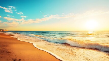 Fototapeta premium Sunny beach with gentle waves and a vibrant sunset over the ocean horizon.