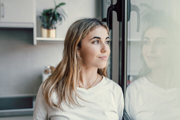 Obraz premium Head shot portrait close up of dreamy smiling woman looking in distance thinking, visualizing good future, excited happy beautiful young female businesswoman dreaming of new opportunities, planning.