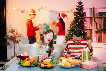 Enjoy the holiday spirit with a joyful Christmas celebration featuring friends, festive food, Santa hats,