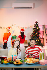 Enjoy the holiday spirit with a joyful Christmas celebration featuring friends, festive food, Santa hats,