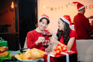 Enjoy the holiday spirit with a joyful Christmas celebration featuring friends, festive food, Santa hats,