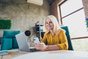 Photo of sweet charming lady assistant wear shirt working modern device indoors workplace...