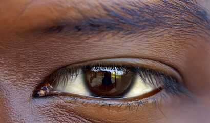 Naklejka premium Focus on dark single eye, with dark skin 