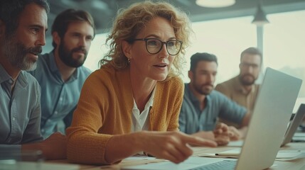 Obraz premium Mature Businesswoman Leading Team Strategy Discussion in Office