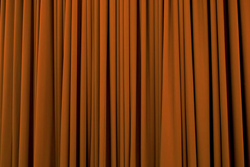 Halloween pumpkin orange curtain with many folds background texture