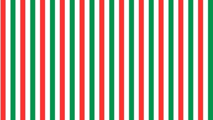 Christmas background with green and red stripes decorated with sparkling stars.	