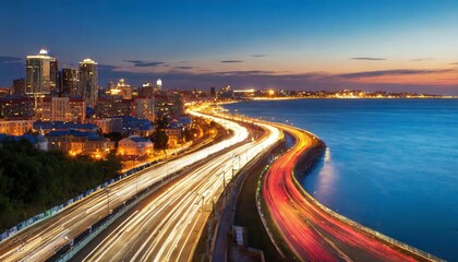 The Motion Blur of a Bustling Urban Highway Captured During the Evening Rush Hour, Framed Against the Illuminated City Skyline as Traffic Streams and Lights Create a Dynamic Sense of